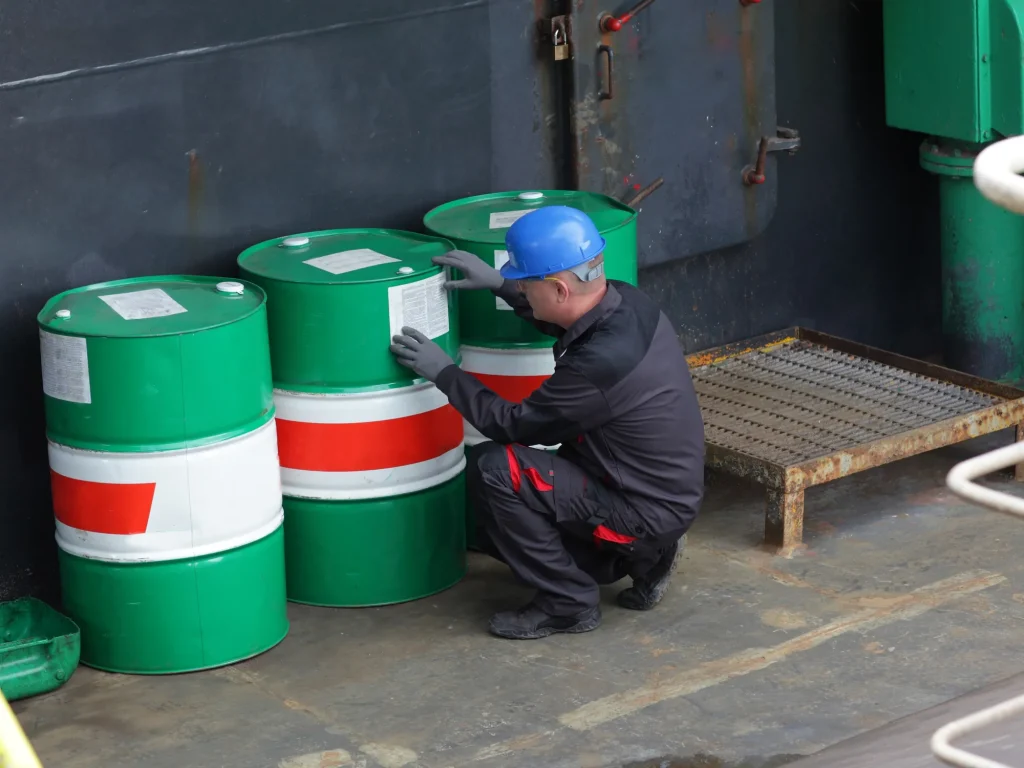 Industrial drum with export compliance labels prepared for shipment.